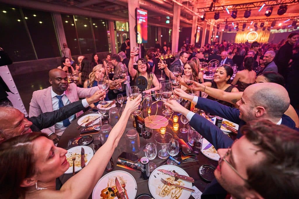 Guests raising a glass at the Grand Banquet